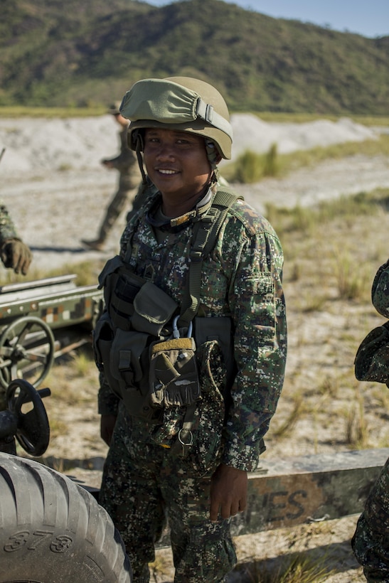 Philippine Marine Tech. Sgt. Cezar Embestro poses for a photo at Crow Valley, Philippines, April 8, 2016. U.S. and Philippine Marines trained together on firing procedures for the M777 Howitzer to build their combined capabilities. Balikatan is an annual Philippines-U.S. military bilateral training exercise that is a signature element of the Philippine-U.S. alliance focused on a variety of missions to include humanitarian assistance maritime law enforcement, and environment protection. 