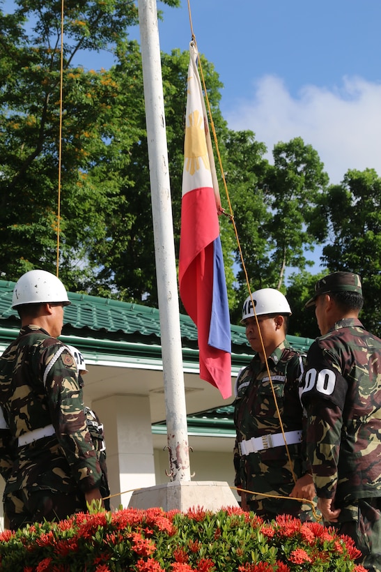 Service members of 3rd Infantry Division, Armed Forces of the Philippines (AFP), raise the flag of the Philippines during a ceremony at Camp Peralta, Capiz, Philippines, in memory of the historical Bataan Death March of 1942, April 09, 2016.  The ceremony was one of many that have brought AFP and U.S. military service members together during the Balikatan Exercise 2016. Balikatan, meaning "shoulder to shoulder," is an annual bilateral training exercise that allows for U.S. and Philippine forces to come together and train for potential real world events, better preparing them to support the local population. The ability of the AFP and U.S. military to work together, partner in capabilities, and plan follow-on operations is essential to the relationship and interoperability of our forces. 