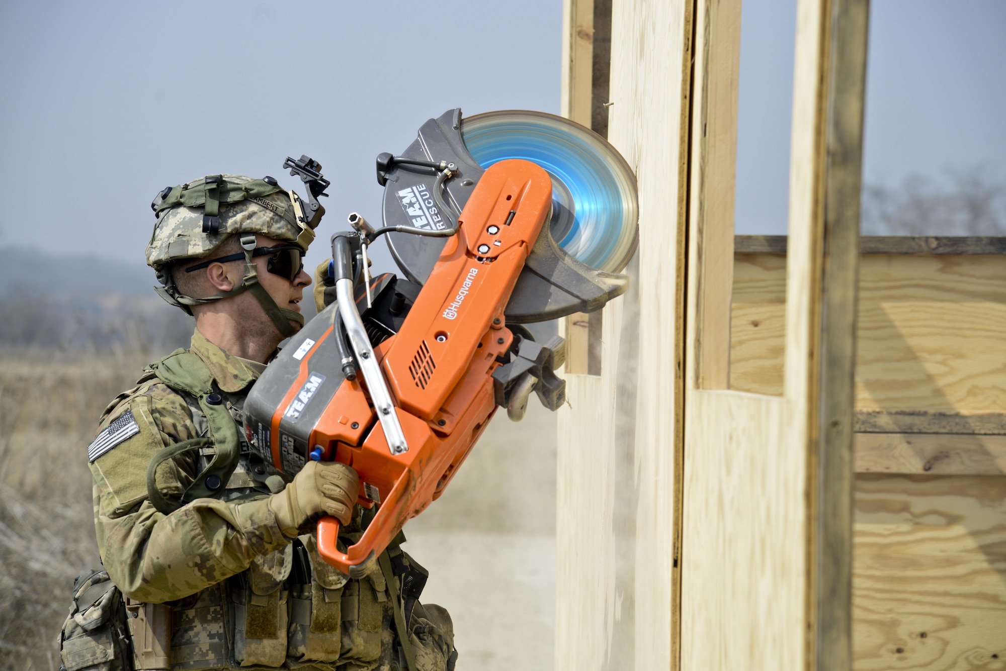 A U.S. Army Joint Security Area Security Battalion fire team member uses a circular saw on a simulated aircraft during a joint search and recovery exercise April 8, 2016, at Camp Bonifas, Republic of Korea. Fire prevention firefighters from the 51st Civil Engineer Squadron participated in the exercise by teaching ROK and U.S. Soldiers how to use the right tools when rescuing people inside of a crashed aircraft. (U.S. Air Force photo by Senior Airman Dillian Bamman/Released)