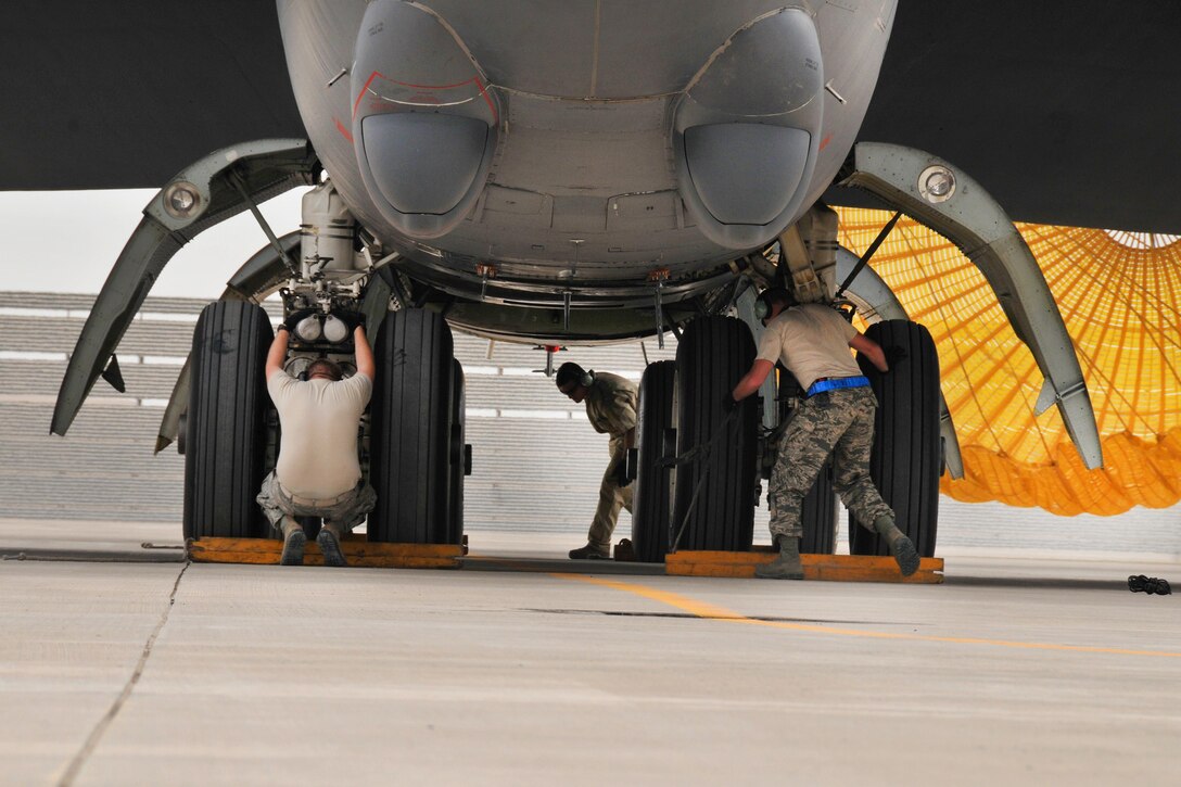 Airmen secure a B-52 Stratofortress aircraft at Al Udeid Air Base, Qatar, April 9, 2016. Air Force photo by Tech. Sgt. Terrica Y. Jones