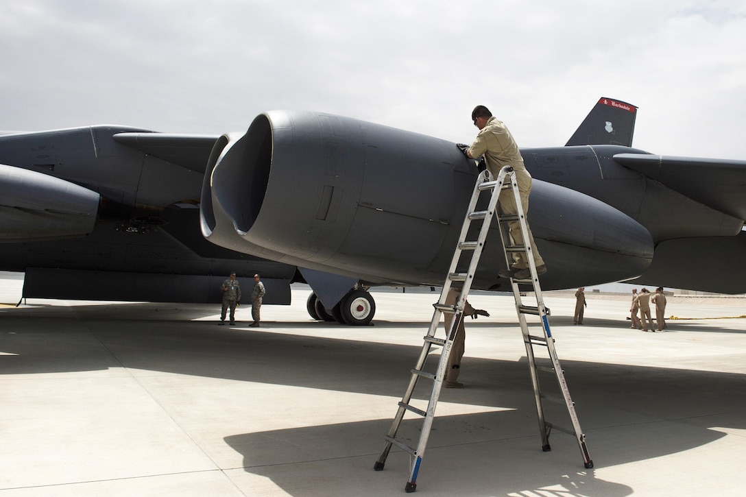 Air Force Tech. Sgt. Walter inspects a B-52 Stratofortress aircraft at Al Udeid Air Base, Qatar, April 9, 2016. Walter is assigned to the 36th Expeditionary Aircraft Maintenance Squadron, deployed from Barksdale Air Force Base, La. Air Force photo by Tech. Sgt. Nathan Lipscomb