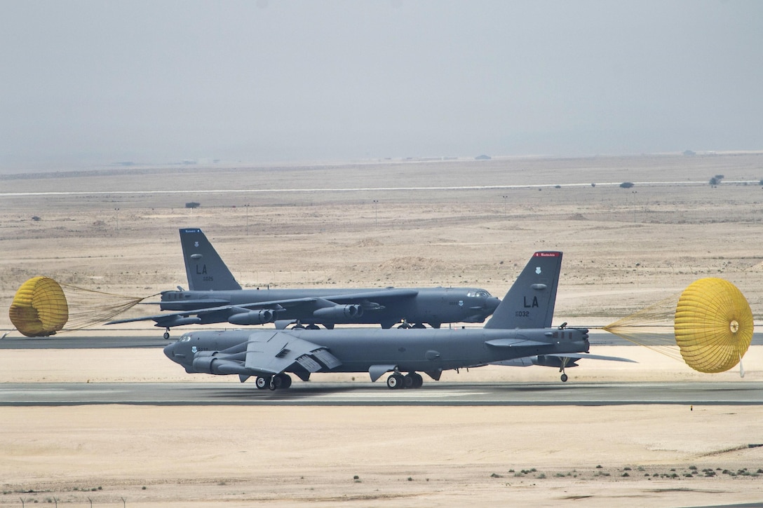 Two Air Force B-52 Stratofortress aircraft taxi on the runway after arriving at Al Udeid Air Base, Qatar, April 9, 2016. Air Force photo by Staff Sgt. Corey Hook