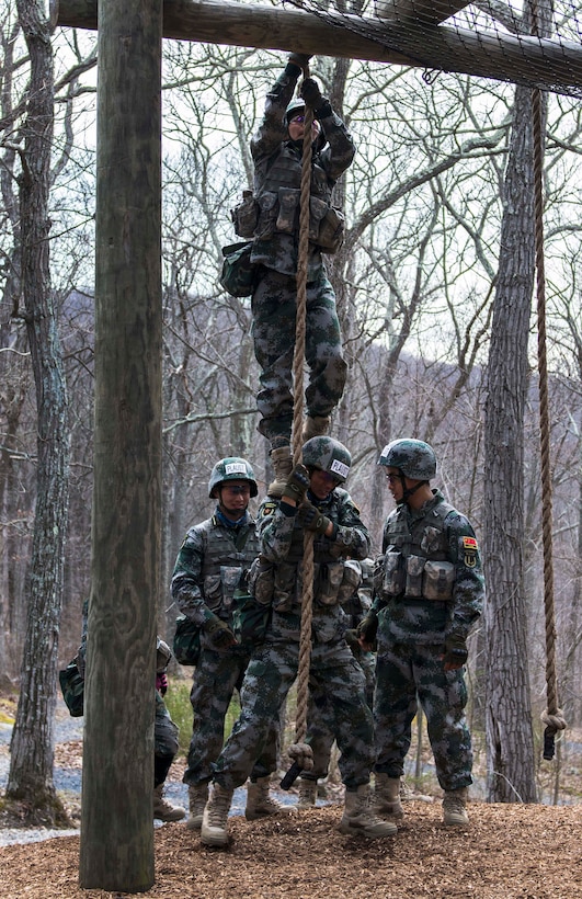 Officer cadets from the University of Science and Technology in China find creative ways to complete 'the tough one" obstacle during the train-up before the 2016 Sandhurst competition at the U.S. Military Academy, West Point, N.Y., April 6, 2016. Army photo by Sgt. 1st Class Brian Hamilton