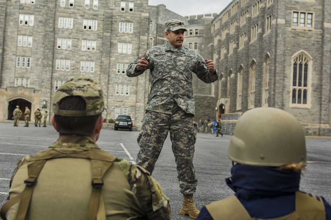 Army Sgt. 1st Class David Palczewski, center, teaches a group of cadets from the U.S. Coast Guard Academy how to handle hand grenades before participating in the 2016 Sandhurst competition at the U.S. Military Academy, West Point, N.Y., April 7, 2016. Palczewski is assigned to the 3rd Battalion, 304th Infantry Regiment, 104th Training Division. The cadets are assigned to the U.S. Coast Guard Academy. Army photo by Sgt. 1st Class Brian Hamilton