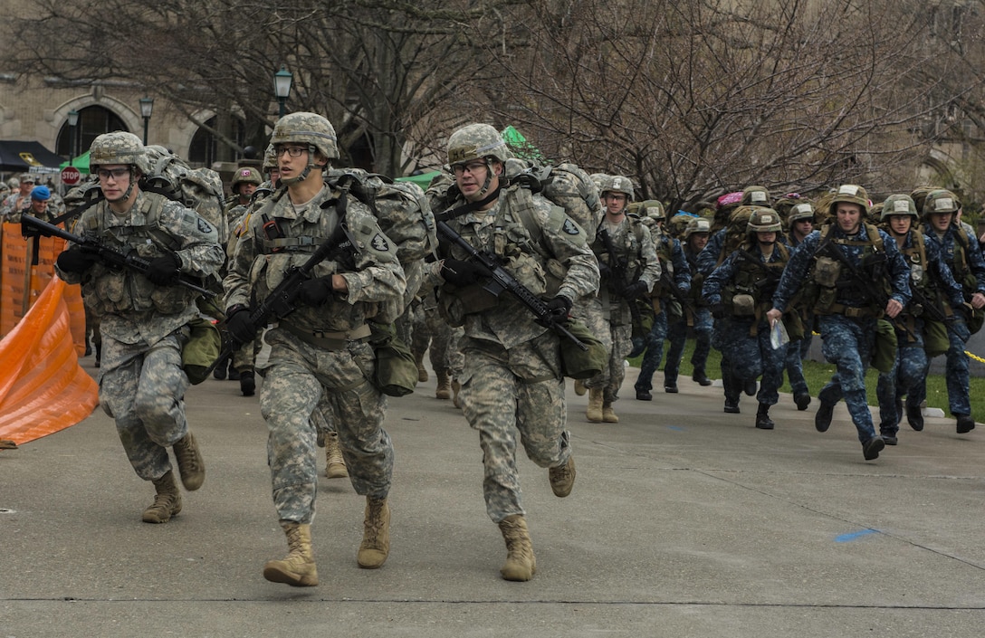 Teams of cadets start the first day of events with a sprint from MacArthur Barracks to Buffalo Soldiers Field for their first station, functional fitness event during the 2016 Sandhurst competition at the U.S. Military Academy, West Point, N.Y., April 8, 2016. Army photo by Sgt. 1st Class Brian Hamilton