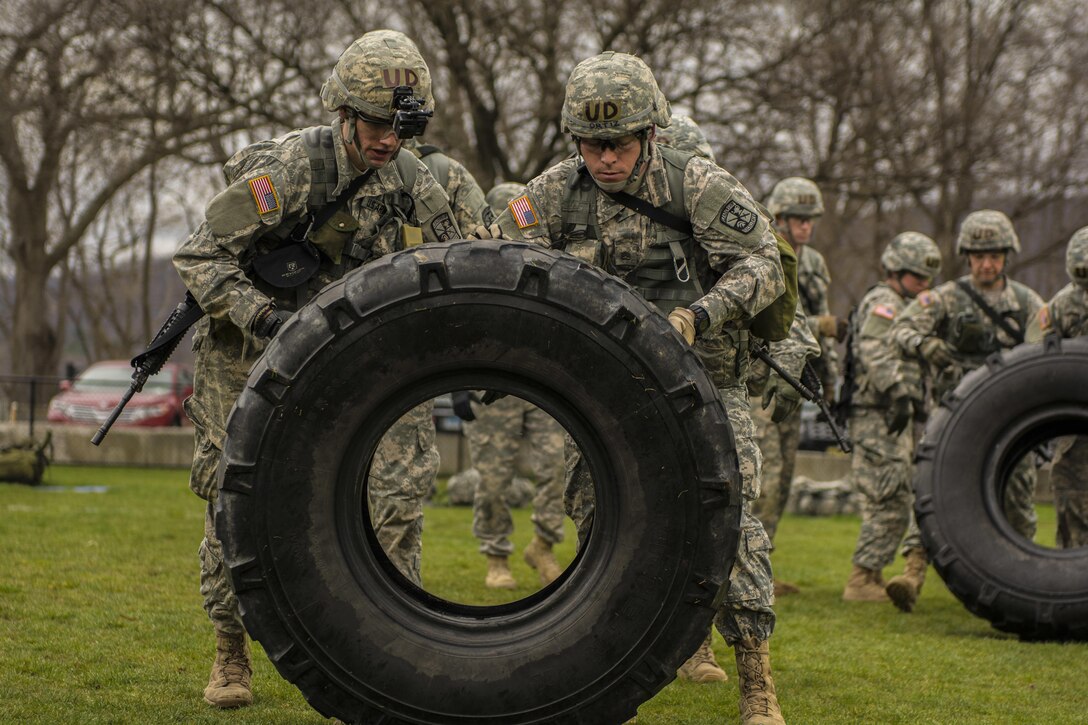 Cadets move two large tires a total of 50 meters as part of the functional athletics event during the 2016 Sandhurst competition at the U.S. Military Academy, West Point, N.Y., April 8, 2016. The cadets are assigned to the Deleware's Reserve Officer Training Corps. Army photo by Sgt. 1st Class Brian Hamilton