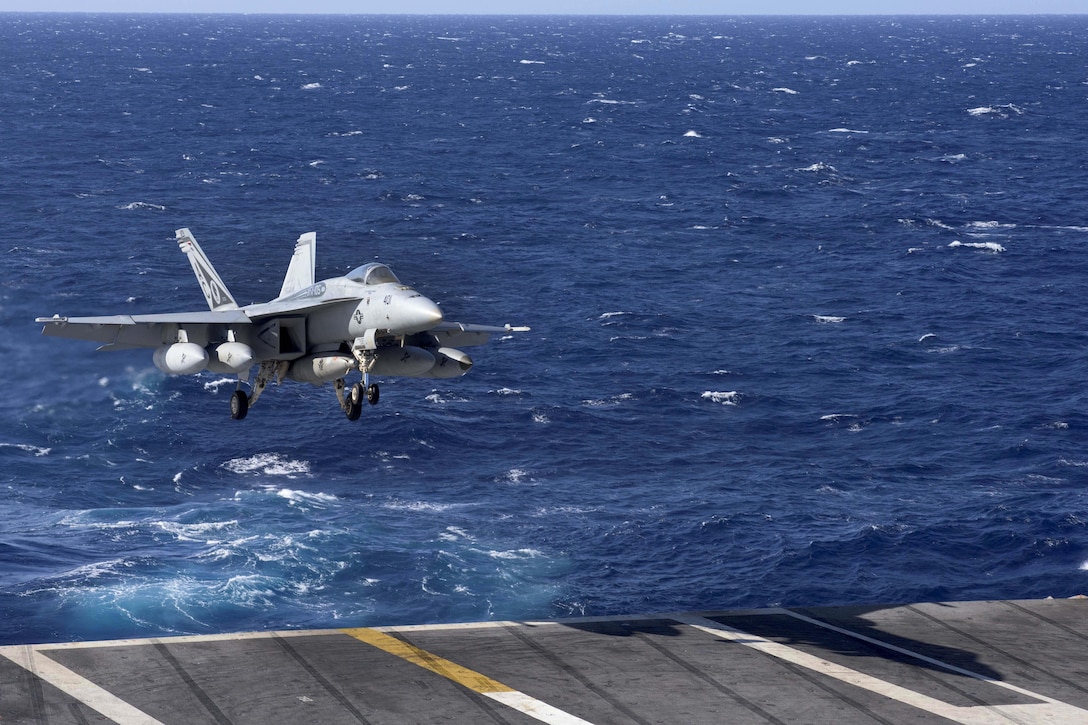 An F/A-18E Super Hornet aircraft assigned to Strike Fighter Squadron 105 prepares to make an arrested landing on the flight deck of the aircraft carrier USS Dwight D. Eisenhower in the Atlantic Ocean, April 3, 2016. Navy photo by Petty Officer 3rd Class Michael R. Gendron