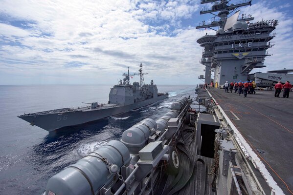 The guided-missile cruiser USS San Jacinto, left, receives fuel from the aircraft carrier USS Dwight D. Eisenhower in the Atlantic Ocean, April 4, 2016. Navy photo by Petty Officer 3rd Class Anderson W. Branch