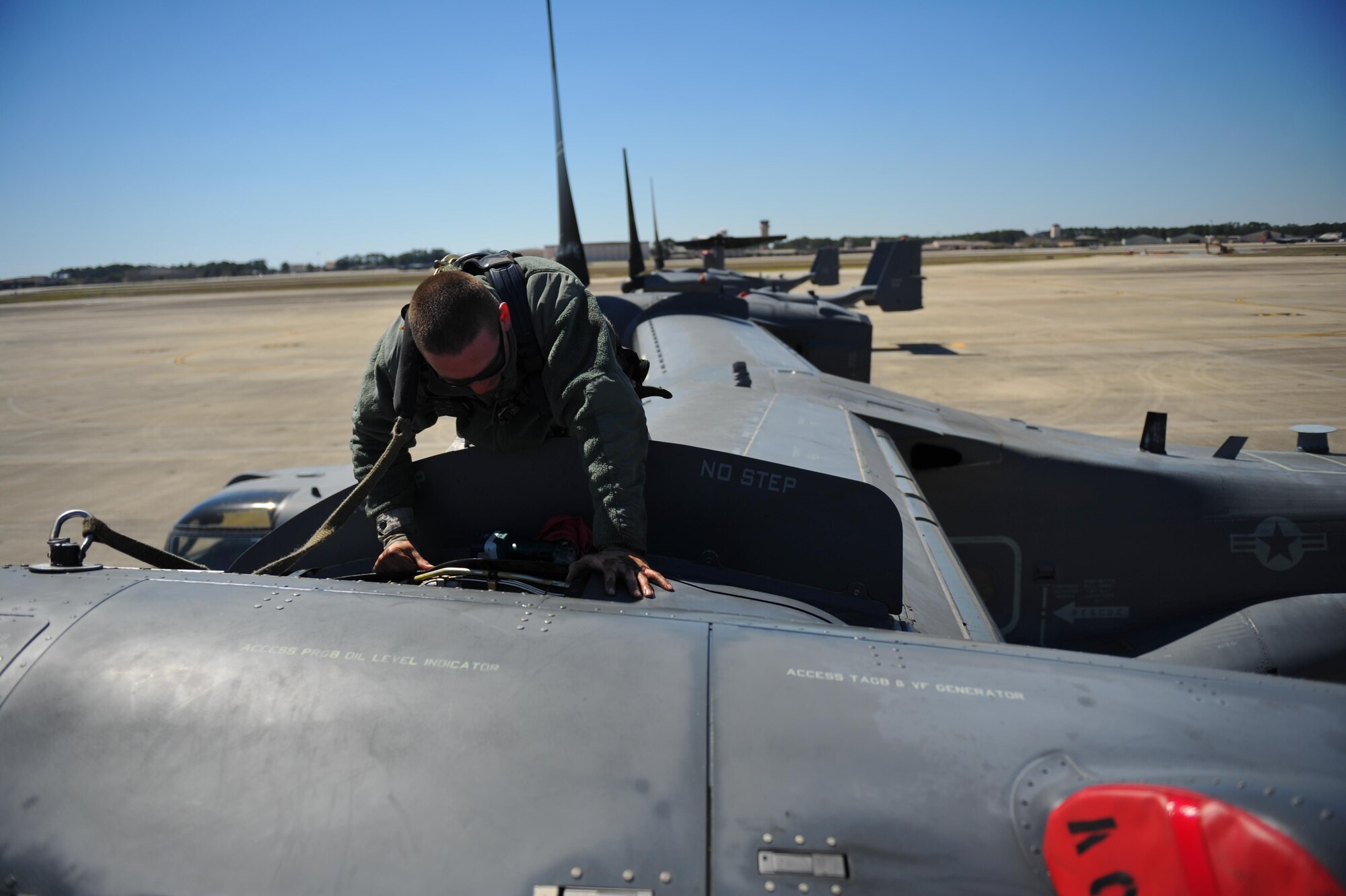 Senior Airman Jacob Anderson, a crew chief with the 801st Special Operations Aircraft Maintenance Squadron, prepares to work on a CV-22B Osprey engine at Hurlburt Field, Fla., March 21, 2016. The 801st SOAMXS supports the 8th Special Operations Squadron, combatant commanders, operational and developmental testing and special operations forces. (U.S. Air Force photo by Airman 1st Class Joseph Pick)