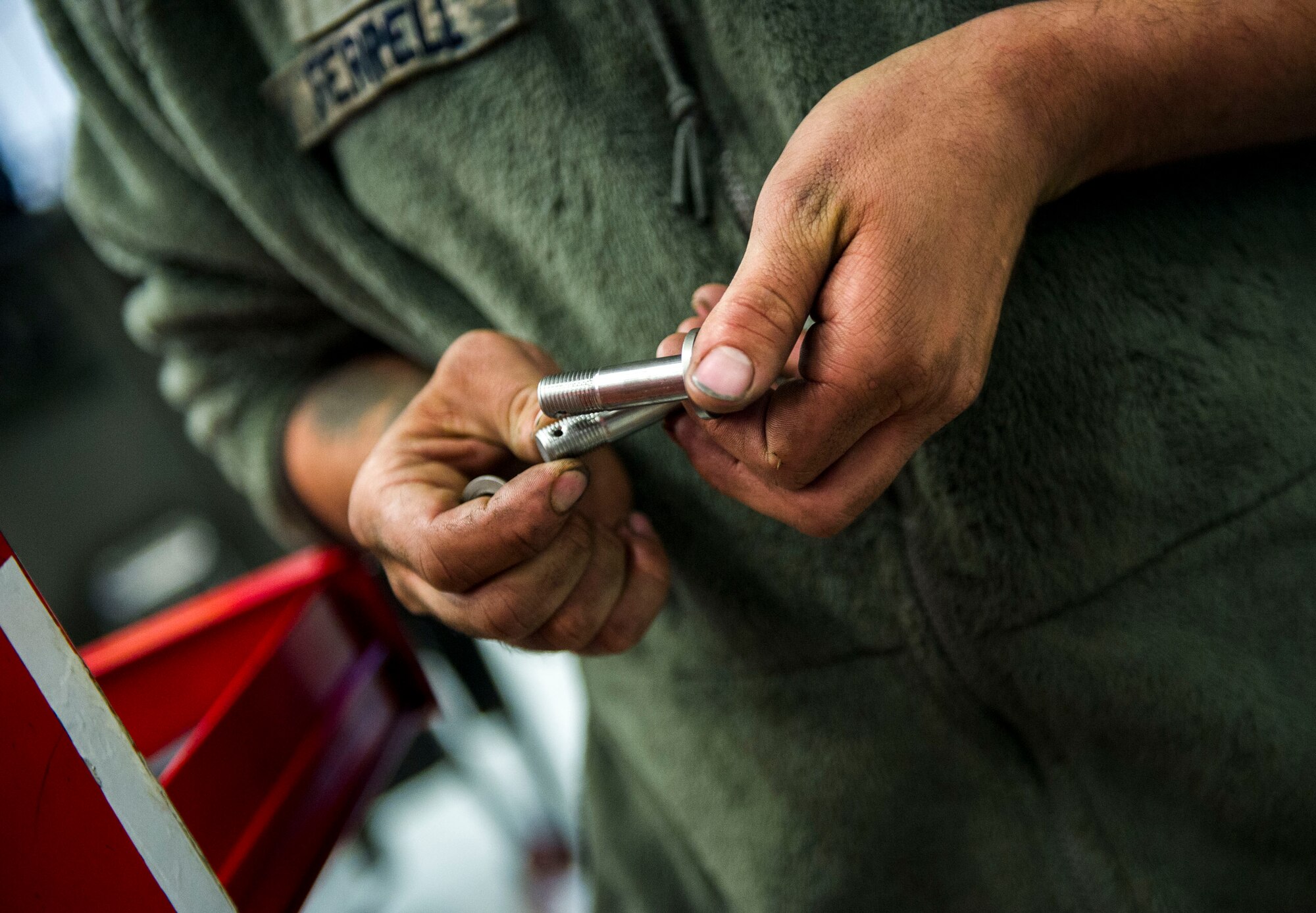Senior Airman Braden Ferrell, a crew chief with the 801st Special Operations Aircraft Maintenance Squadron, preps engine support links prior to a CV-22B Osprey engine re-install at Hurlburt Field, Fla., March 21, 2016. The 801st SOAMXS won the 2015 Maintenance Effectiveness Award for small aircraft maintenance unit. The Air Force MEA recognizes maintenance units who have effectively managed resources in three separate areas: mission accomplishment, innovative and effective use of maintenance resources, and personnel quality of life programs. (U.S. Air Force photo by Senior Airman Krystal M. Garrett)