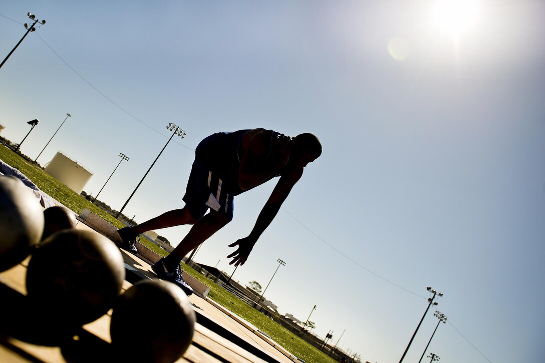 Paul O’Neil, a Warrior Games athlete, prepares to toss the shot put during the track and field session part of the Air Force team’s training camp at Eglin Air Force Base, Fla., April 4, 2016. Air Force photo by Samuel King Jr.
