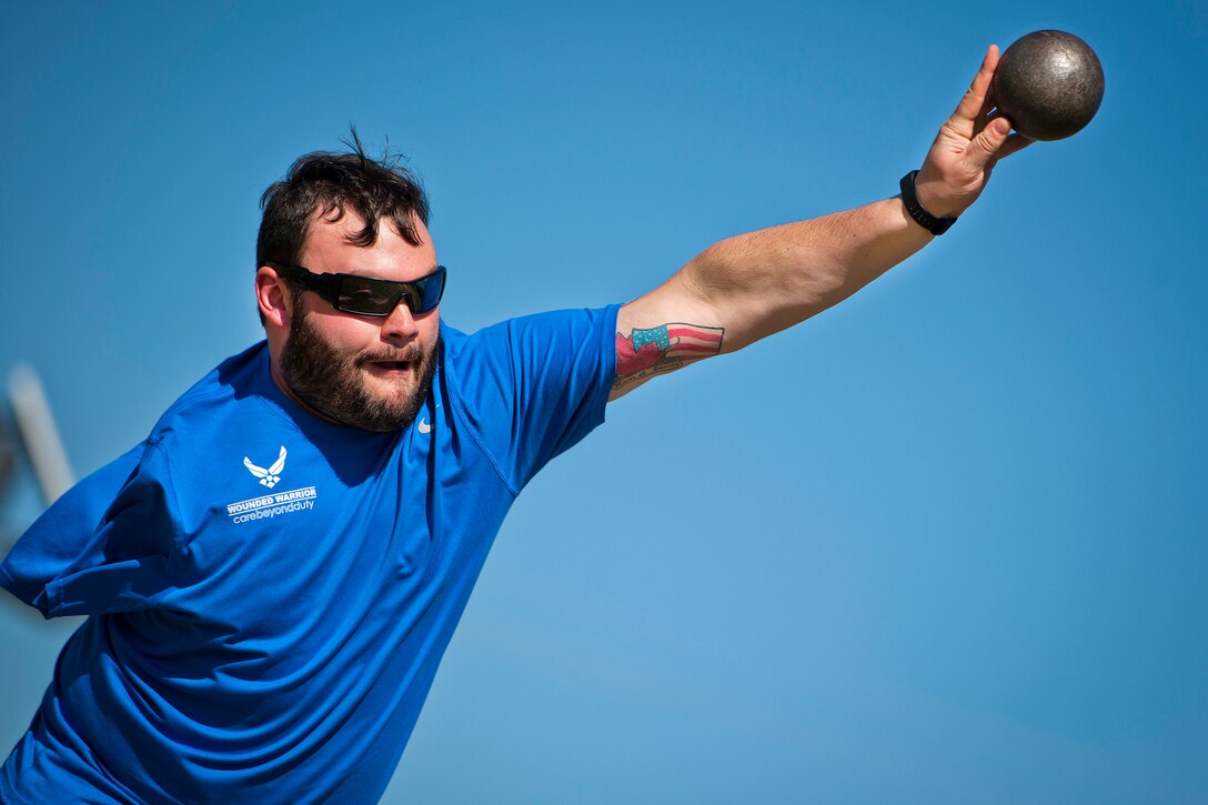 Lucas Purser, a Warrior Games athlete, releases the shot put during an afternoon track and field session during the Air Force team’s training camp at Eglin Air Force Base, Fla., April 4, 2016. Air Force photo by Samuel King Jr.