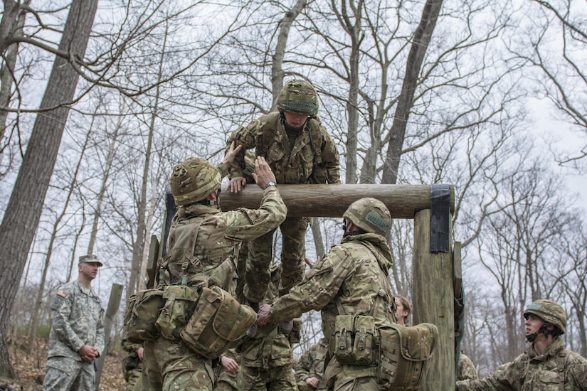 Sgt. 1st Class Henry Johnson, Co. A, 3rd Bn., 304th Inf. Reg. (USMA), 104th Training Div. (LT), watches as one of two teams of cadets from the Royal Military Academy Sandhurst located in Camberley, United Kingdom, practice on the obstacle course prior to the 2016 Sandhurst Competition which takes place at on the United States Military Academy campus at West Point, N.Y., Apr. 8-9. This year 60 teams from 13 countries are competing for the coveted British officer's sword. The competition began as a friendly contest of skill, stamina, and endurance between the United States and their counterparts from the United Kingdom in 1967. (U.S. Army photo Sgt. 1st Class Brian Hamilton/released)