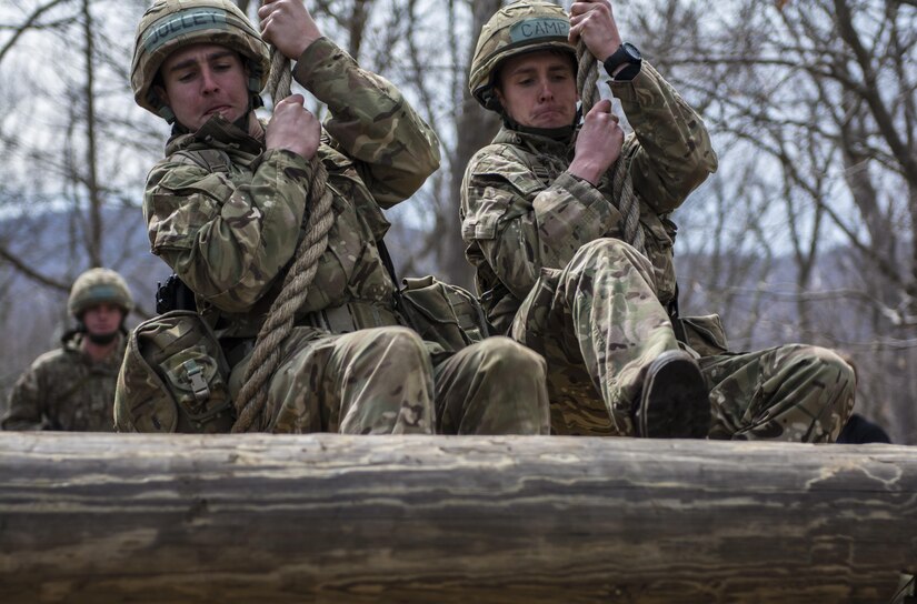 British Officer Cadets Perry Jolly and Samuel Camp, both from the Royal Military Academy Sandhurst located in Camberley, United Kingdom, practice maneuvering a rope swing prior to the Sandhurst competition at the United States Military Academy at West Point, N.Y., April 6, 2016. (U.S. Army photo Sgt. 1st Class Brian Hamilton)