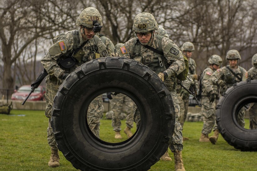 Cadets from the University of Deleware's Reserve Officer Training Corps move two large tires a total of 50 meters as part of the functional athletics test during the first day of competition at the 2016 Sandhurst competition held at West Point, N.Y., April 8, 2016. The functional athletics station was the first of 13 stations at this years competition. In all, 60 teams of cadets from military acdemies in 13 countries are competiting in the competition. (U.S. Army photo Sgt. 1st Class Brian Hamilton/released)