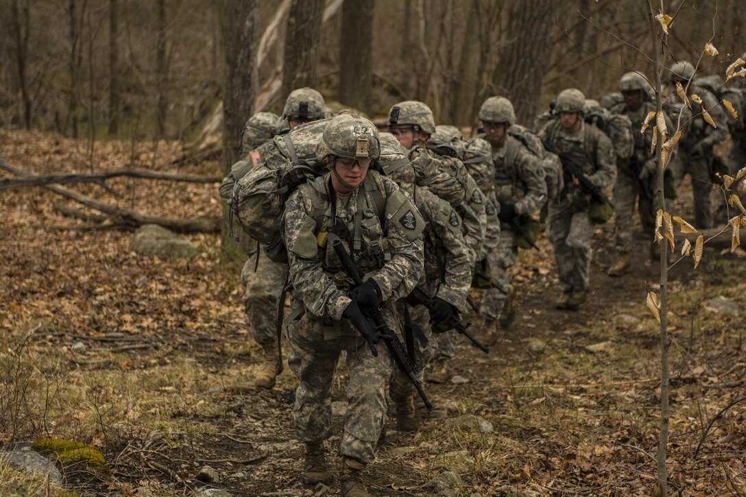 A team from the United States Military Academy's Corps of Cadets make the 6 mile trek across the Appalachain Mountain range to their second station,rifle marksmanship,  during the first day of competition at the 2016 Sandhurst competition held at West Point, N.Y., April 8, 2016. The rifle marksmanship station was the second of 13 stations at this years competition. In all, 60 teams of cadets from military acdemies in 13 countries are competiting for the coveted British officer's sword. (U.S. Army photo Sgt. 1st Class Brian Hamilton/released)