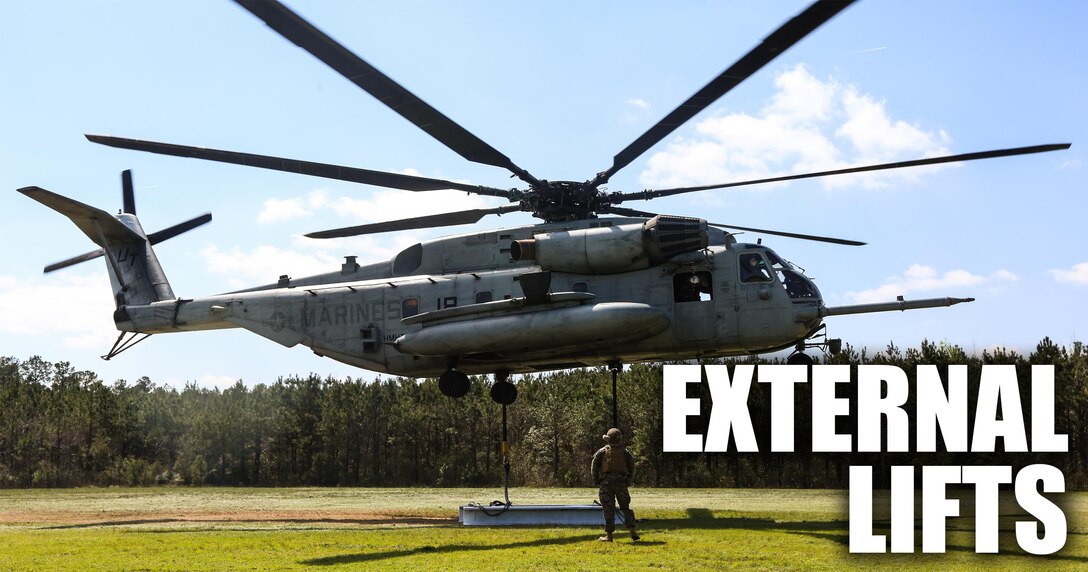 Marines with Marine Heavy Helicopter Training Squadron 302 wait aboard a CH-53E Super Stallion for signals from a Combat Logistics Battalion 6, Transportation Support Battalion, landing support specialist, indicating it is safe to take off with the cargo, during external lifts at landing zone Phoenix, Camp Davis, North Carolina, April 6, 2016. The purpose of external lifts is to transport larger amounts of supplies and heavy gear where other ground vehicles can’t access. (U.S. Marine Corps photo illustration by Lance Cpl. Aaron Fiala/Released.)
