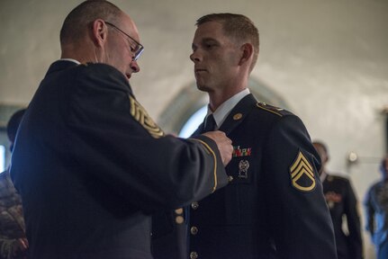 Command Sgt. Maj. Peter Running, the senior enlisted advisor for the U.S. Army Civil Affairs and Psychological Operations Command, announces the noncommisioned officer USACAPOC best warrior winner, Staff Sgt. Alex Herrmann, a civil affairs specialist from Amarillo, Texas, representing the 350th Civil Affairs Command, at Fort Hunter Liggett, Calif., April 7, 2016. This year’s Best Warrior competition will determine the top noncommissioned officer and junior enlisted Soldier who will represent USACAPOC in the Army Reserve Best Warrior competition later this year. (U.S. Army photo by Master Sgt. Mark Burrell, 352nd CACOM)