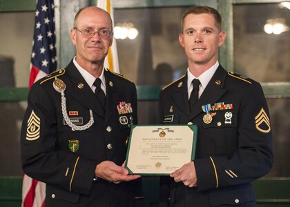 Command Sgt. Maj. Peter Running, the senior enlisted advisor for the U.S. Army Civil Affairs and Psychological Operations Command, announces the noncommisioned officer USACAPOC best warrior winner, Staff Sgt. Alex Herrmann, a civil affairs specialist from Amarillo, Texas, representing the 350th Civil Affairs Command, at Fort Hunter Liggett, Calif., April 7, 2016. This year’s Best Warrior competition will determine the top noncommissioned officer and junior enlisted Soldier who will represent USACAPOC in the Army Reserve Best Warrior competition later this year. (U.S. Army photo by Master Sgt. Mark Burrell, 352nd CACOM)