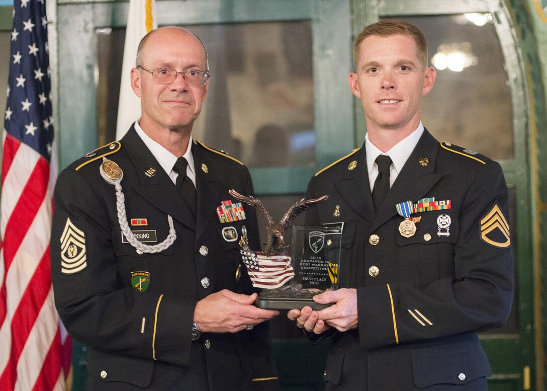 Command Sgt. Maj. Peter Running, the senior enlisted advisor for the U.S. Army Civil Affairs and Psychological Operations Command, announces the noncommisioned officer USACAPOC best warrior winner, Staff Sgt. Alex Herrmann, a civil affairs specialist from Amarillo, Texas, representing the 350th Civil Affairs Command, at Fort Hunter Liggett, Calif., April 7, 2016. This year’s Best Warrior competition will determine the top noncommissioned officer and junior enlisted Soldier who will represent USACAPOC in the Army Reserve Best Warrior competition later this year. (U.S. Army photo by Master Sgt. Mark Burrell, 352nd CACOM)