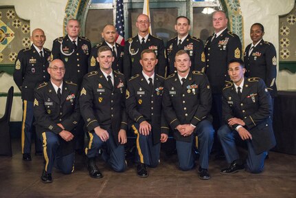 Command Sgt. Maj. Peter Running, the senior enlisted advisor for the U.S. Army Civil Affairs and Psychological Operations Command, announces the NCO and enlisted USACAPOC best warriors. Staff Sgt. Alex Herrmann, a civil affairs specialist from Amarillo, Texas, representing the 350th Civil Affairs Command, and Spc. Ian Duprey, a chaplain's assistant from Hague, Va., representing the 437th Civil Affairs Battalion at Fort Hunter Liggett, Calif., April 7, 2016. This year’s Best Warrior competition will determine the top noncommissioned officer and junior enlisted Soldier who will represent USACAPOC in the Army Reserve Best Warrior competition later this year. (U.S. Army photo by Master Sgt. Mark Burrell, 352nd CACOM)