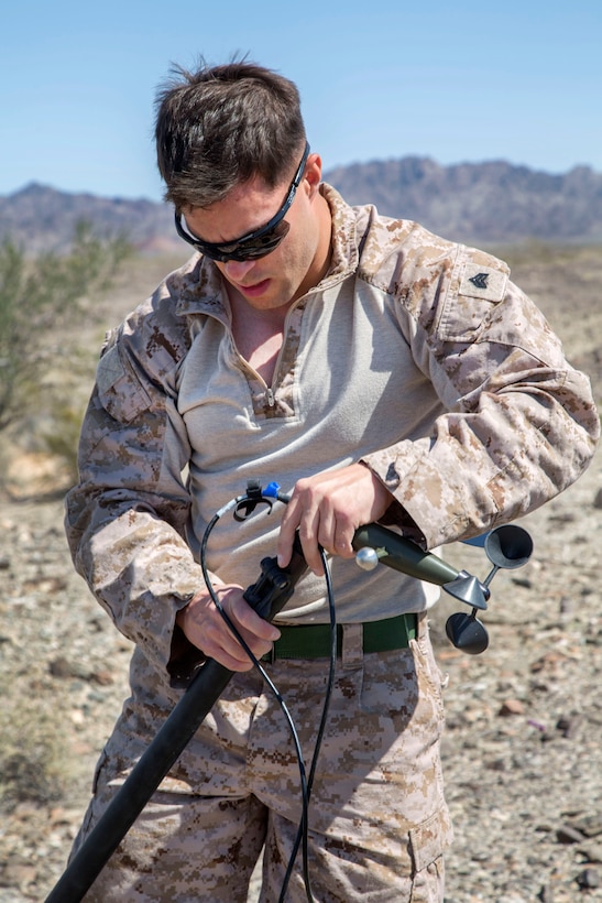 Marine Corps Sgt. Brad Eisenschenk constructs an automated weather observing system during Weapons and Tactics Instructor course 2-16 at landing zone bull, located in the Chocolate Mountain Aerial Gunnery Range, Arizona, March 26, 2016. Marine Corps photo by Lance Cpl. Anabel Abreu-Rodriguez
