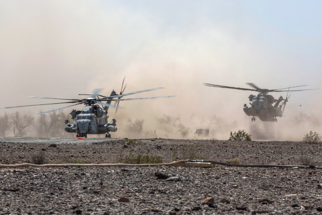 Marine Corps CH-53E Super Stallion helicopters land for refueling during Weapons and Tactics Instructor course 2-16 at landing zone bull, located in the Chocolate Mountain Aerial Gunnery Range, Arizona, March 26, 2016. The helicopter crews are assigned to Marine Heavy Helicopter Squadron 361 and Marine Heavy Helicopter Squadron 461. Marine Corps photo by Lance Cpl. Anabel Abreu-Rodriguez