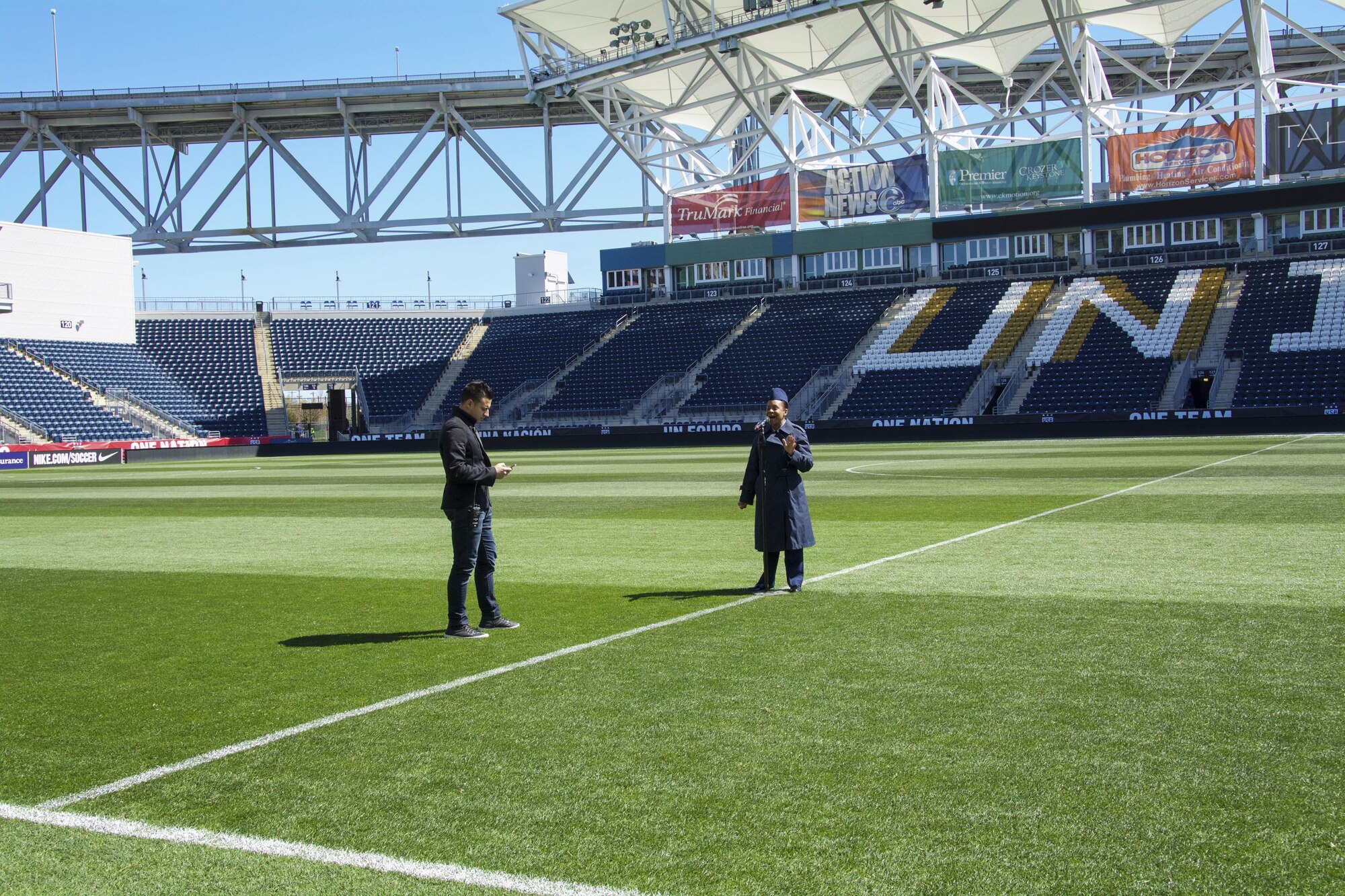 Master Sgt. Shana Wallace, of the 512th Airlift Wing, rehearses singing the national anthem at Talen Energy Stadium, Chester, Pa., April 10, 2016, before the US Women's Soccer team played Columbia's national soccer team. The friendly competition was the second in a month between the two teams, and the US team won both matches 7-0 and 3-0.
