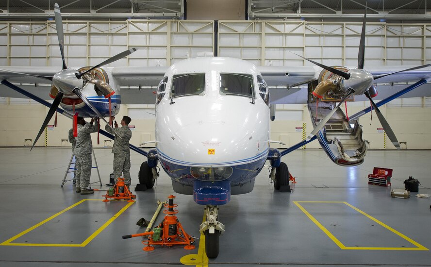 Airmen perform maintenance on the fuel systems of a C-145 Skytruck in a hangar at Duke Field Fla., Feb. 25.  The Airmen are part of the fuel systems shop within the 919th Special Operations Maintenance Group.  (U.S. Air Force photo/Tech. Sgt. Sam King)