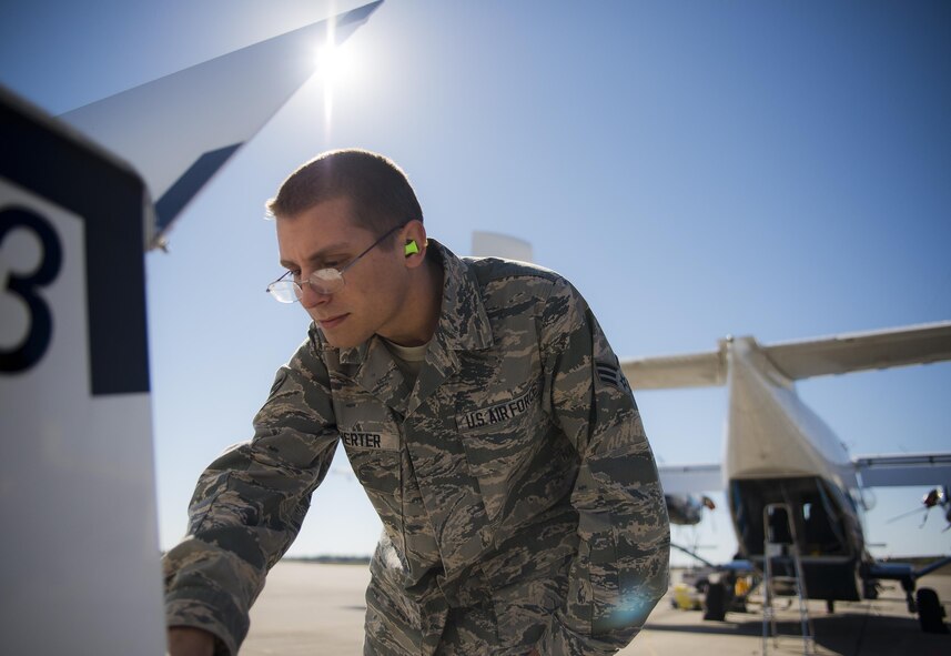 Senior Airman Andrew McWherter, 592nd Special Operations Maintenance Squadron, turns on a generator before beginning work on a C-145 Skytruck on the flightline at Duke Field Fla., Feb. 25.  McWherter, an active duty Airman, works with 919th Special Operations Wing reservists in the avionics shop of the Wing’s maintenance group.  (U.S. Air Force photo/Tech. Sgt. Sam King)