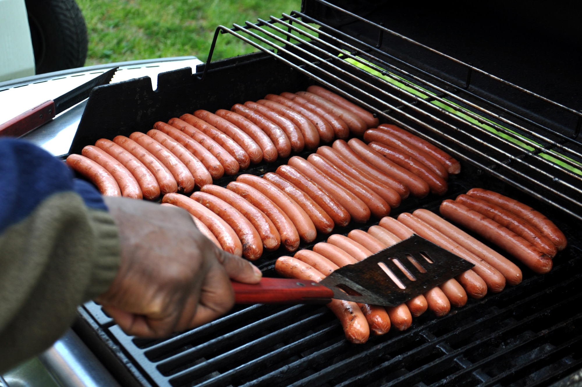 Members of the Airman and Family Readiness Center prepare hot dogs April 9, 2016, during the Month of the Military Child Carnival at Seymour Johnson Air Force Base, North Carolina. More than 200 members of Team Seymour attended the event which honored military children. (U.S. Air Force photo/Staff Sgt. Chuck Broadway)