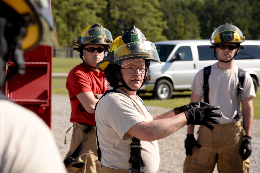 Air Force Tech. Sgt. Ben Sudduth, center, gives a safety brief to airmen during an aircraft firefighting training exercise at the 165th Airlift Wing's Regional Fire Training Facility in Savannah, Ga., April 4th, 2016. Sudduth is assigned to the Vermont Air National Guard’s 158th Fighter Wing. Air National Guard photo by Tech. Sgt. Andrew J. Merlock 