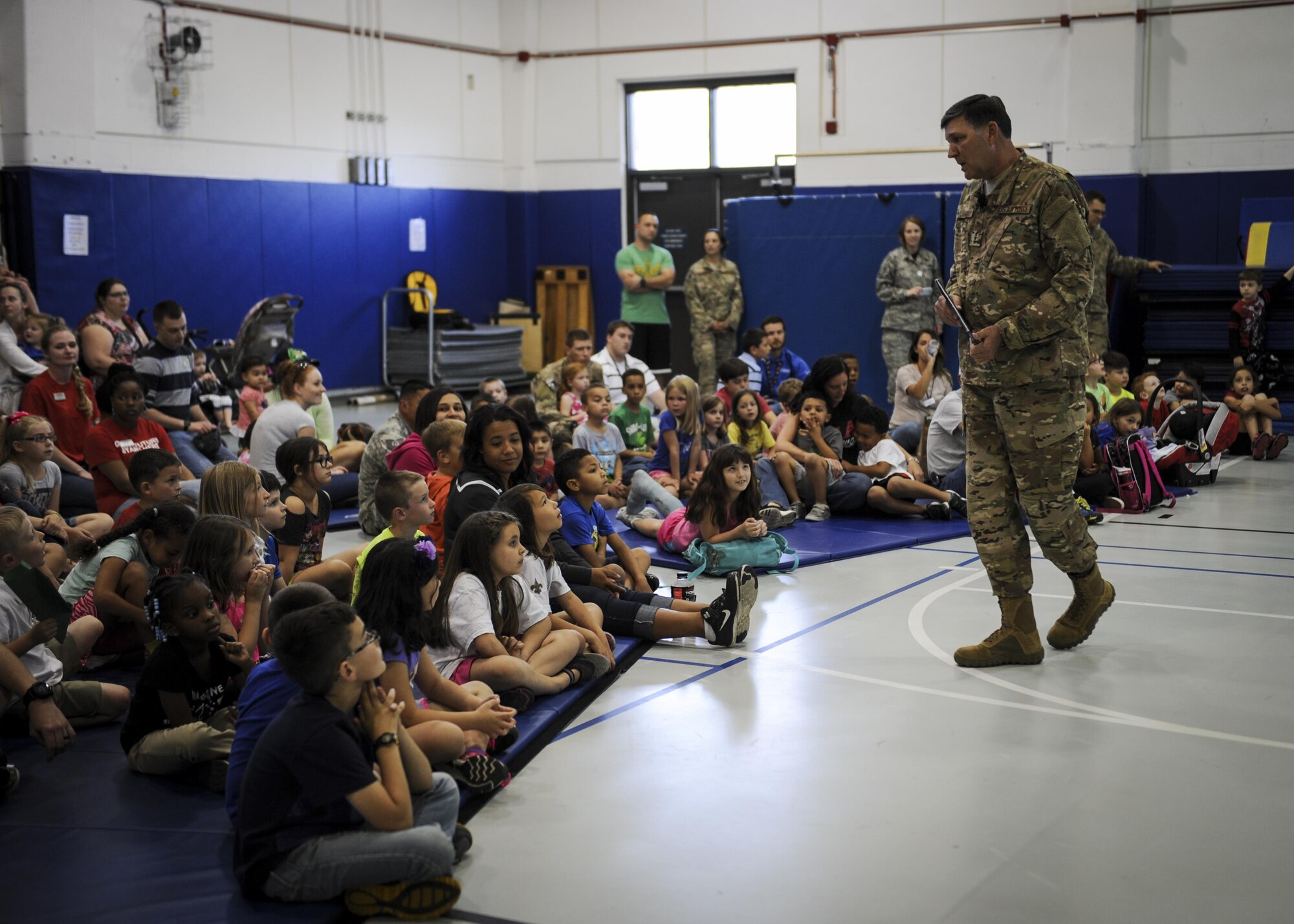 Lt. Gen. Brad Heithold, the commander of Air Force Special Operations Command, speaks to children during “Tell me a Story” at the youth center, Hurlburt Field, Fla., April 8, 2016. “Tell me a Story” was created to empower military children through literature and their own stories. (U.S. Air Force photo by Senior Airman Meagan Schutter)