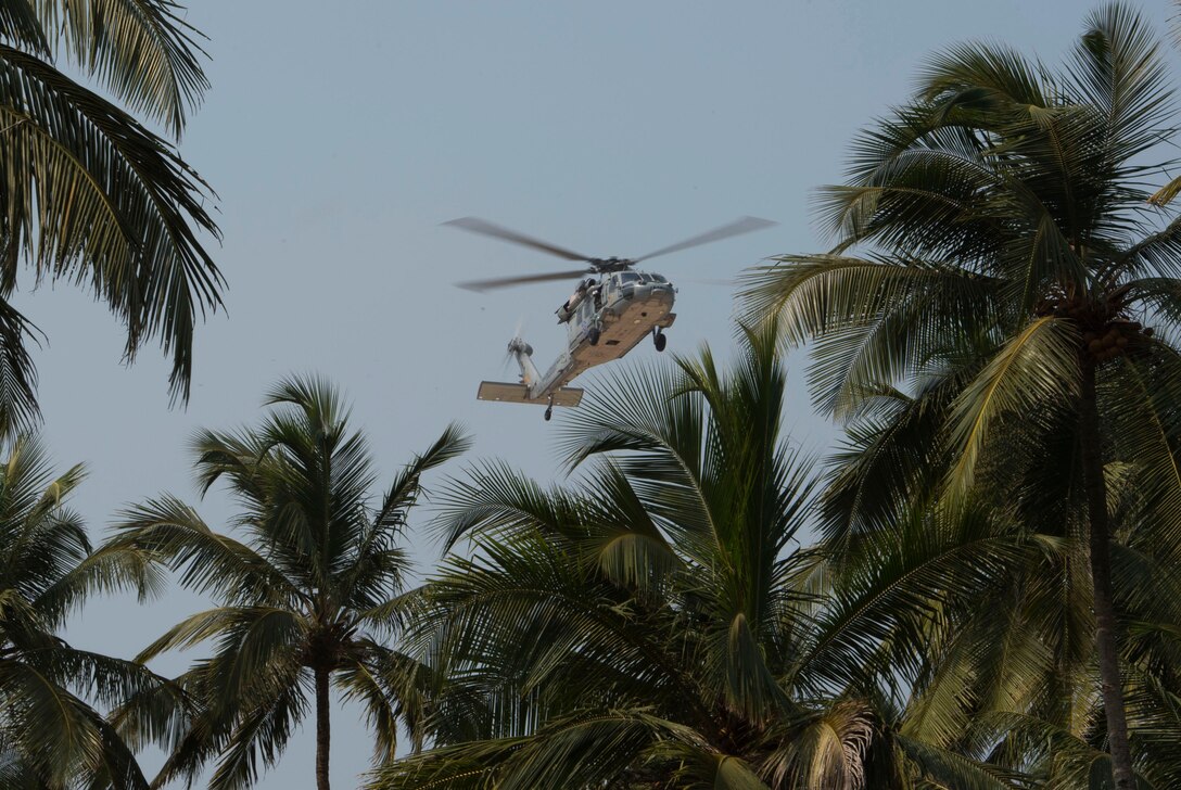 A U.S. Navy helicopter arrives in Goa, India, to transport Defense Secretary Ash Carter to the Karwar naval base to visit the Indian aircraft carrier INS Vikramaditya, April 11, 2016. Carter is visiting India to solidify the rebalance to the Asia-Pacific region. DoD photo by Air Force Senior Master Sgt. Adrian Cadiz