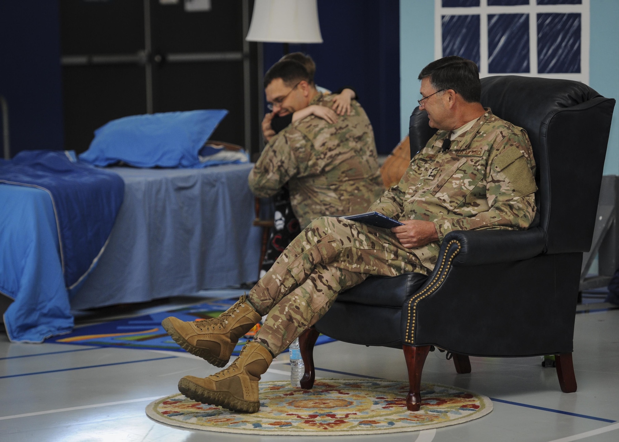 Lt. Gen. Brad Heithold, the commander of Air Force Special Operations Command, speaks to children during “Tell me a Story” at the youth center, Hurlburt Field, Fla., April 8, 2016. “Tell me a Story” was created to empower military children through literature and their own stories. (U.S. Air Force photo by Senior Airman Meagan Schutter)