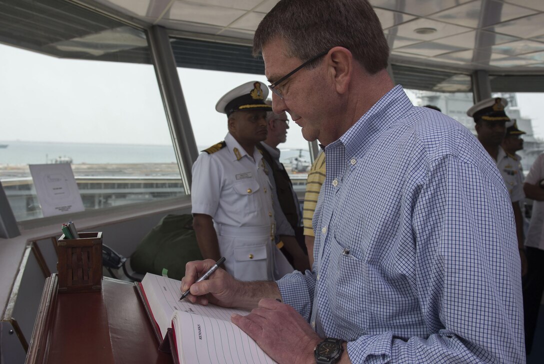 Defense Secretary Ash Carter signs a guest book at the Karwar naval base in India, April 11, 2016. DoD photo by Air Force Senior Master Sgt. Adrian Cadiz