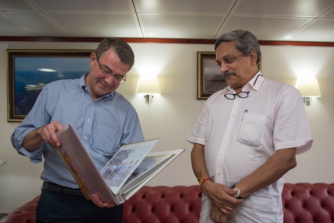 Indian Defense Minister Manohar Parrikar, right, presents Defense Secretary Ash Carter a photo album after Carter's tour of the Indian aircraft carrier INS Vikramaditya at the Karwar naval base in India, April 11, 2016. DoD photo by Air Force Senior Master Sgt. Adrian Cadiz