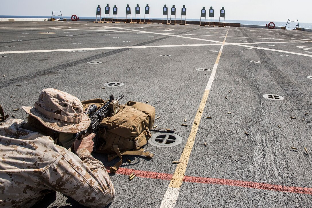 U.S. Marines with the 13th Marine Expeditionary Unit conduct a live-fire range to calibrate their rifle combat optics aboard the USS New Orleans, Indian Ocean, Apr. 2, 2016. The Boxer Amphibious Ready Group/13th MEU team is currently deployed to the 5th Fleet area of responsibility to support regional stability and security.(U.S. Marine Corps photo by Lance Cpl. Alvin Pujols/RELEASED)