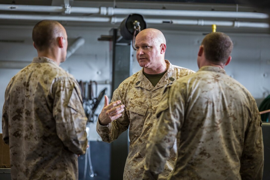 Sergeant Maj. William Slade, sergeant major of the 13th Marine Expeditionary Unit, addresses the Marines aboard the USS New Orleans, Arabian Sea, Apr. 5, 2016. The Boxer Amphibious Ready Group/13th MEU team is currently deployed to the 5th Fleet area of responsibility to support regional stability and security. (U.S. Marine Corps photo by Lance Cpl. Alvin Pujols/RELEASED)