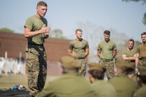 Sgt. John Taylor, a black belt Martial Arts Instructor with 2nd Transportation Support Battalion, 2nd Marine Logistics Group, leads Canadian cadets in a guided discussion about the Marine Corps' core values following a Marine Corps Martial Arts Program demonstration at Camp Lejeune, N.C., March 16, 2016.  A total of 46 cadets with the Argyll and Sutherland Highlanders of Canada Regimental Cadet Corps visited the base and multiple units as part of an educational tour to better understand how foreign militaries function. 