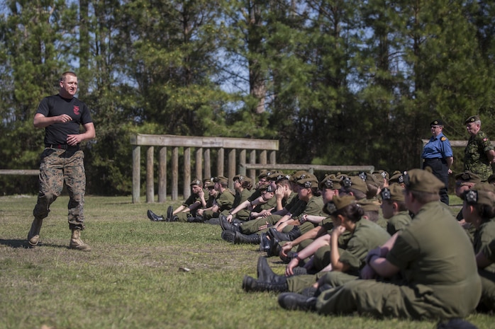 Staff Sgt. Chase Carson, a Martial Arts Instructor Trainer with Combat Logistics Battalion 6, 2nd Marine Logistics Group, motivates Canadian cadets before giving a demonstration of the Marine Corps Martial Arts Program at Camp Lejeune, N.C., March 16, 2016. A total of 46 cadets with the Argyll and Sutherland Highlanders of Canada Regimental Cadet Corps visited the base and multiple units as part of an educational tour to better understand how foreign militaries function. 