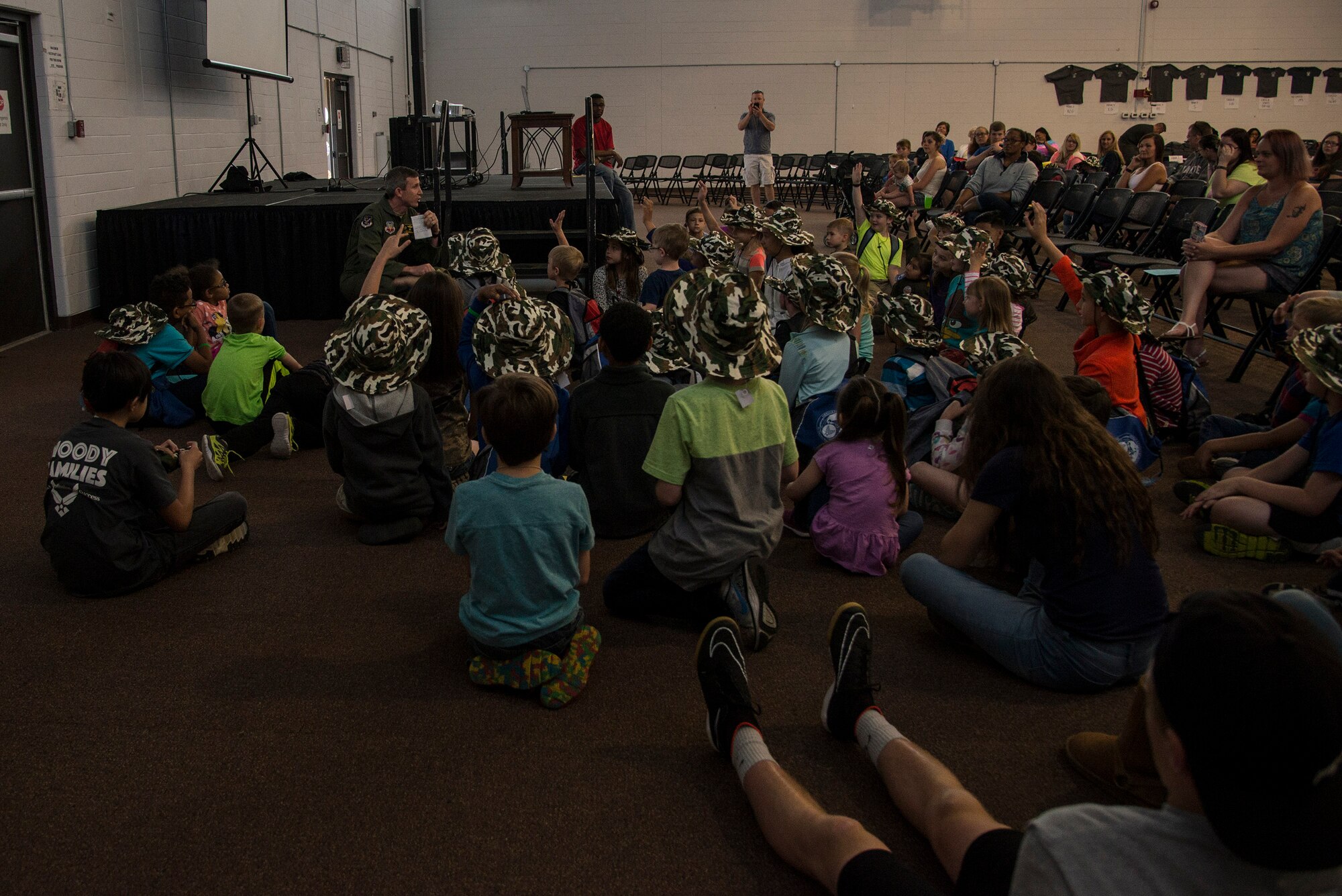U.S. Air Force Col. Thomas Kunkel, 23d Wing commander, gives a mission brief during a kids’ deployment line, April 9, 2016, at Moody Air Force Base, Ga. The event gave children the chance to experience what Airmen go through while preparing to deploy. (U.S. Air Force photo by Airman 1st Class Janiqua P. Robinson/Released)