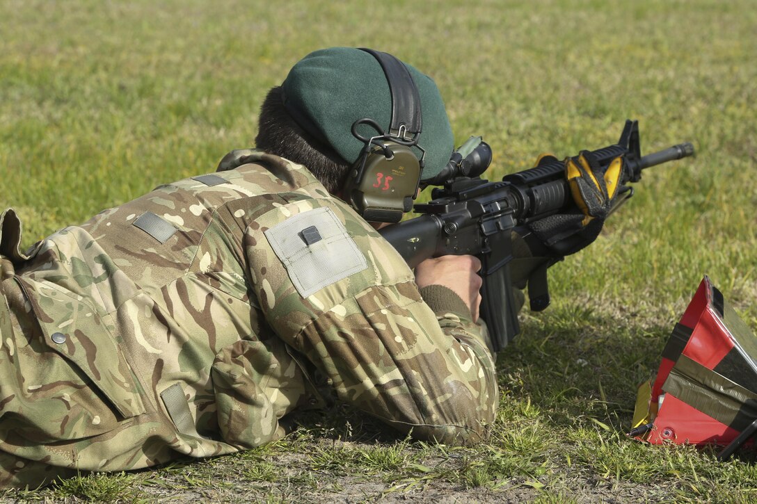 A British Royal Marine fires at his target at the 500 yard line during the Eastern Division Shooting Matches at Stone Bay Rifle Range on Marine Corps Base Camp Lejeune March 24. During the ten-day competition, shooters compete to earn individual shooting medals and team trophies while improving on the fundamentals of marksmanship with the M16A4 and M4 service rifles and M9 service pistol. (U.S. Marine Corps photo by Cpl. Mark Watola /released)