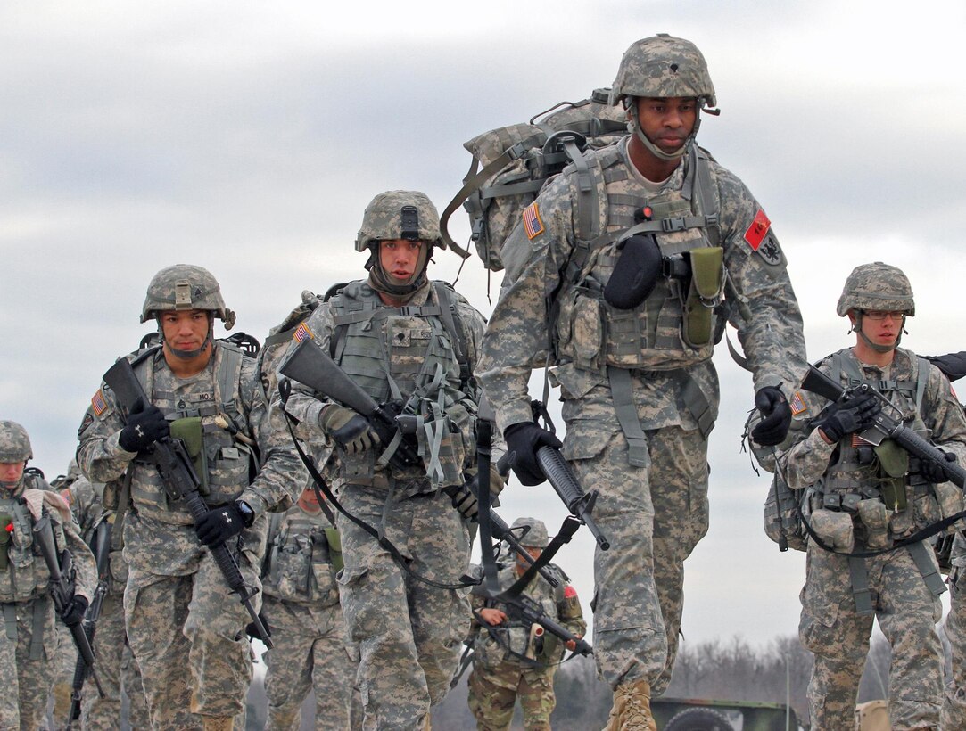 U.S. Army Reserve Staff Sgt. Joseph Mojica, 78th Training Division, 84th Training Command, left, Spc. Justin Ruzicak, 1st Battalion, 158th Aviation Regiment, 11th Theater Aviation Command (TAC) and Spc. Jason McCord, 2nd Battalion, 58th Aviation Operations, TAC, were among the competitors in the Ruck March event of the 2016 Joint Best Warrior Competition on Fort Knox, Kentucky, March 23, 2016. (U.S. Army Photo by Clinton Wood/Released)