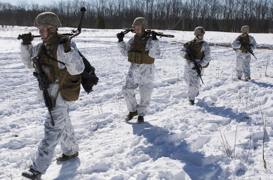 Marines with Company I, 3rd Battalion, 25th Marine Regiment, 4th Marine Division, Marine Forces Reserve, begin the infantry squad battle course during exercise Arctic Eagle at Camp Grayling, Mich., April 5, 2016.  The Marines joined soldiers with the U.S. Army National Guard and the Danish Home Guard in the bilateral exercise, designed to simulate a joint task force defending key infrastructure in the arctic region. (U.S. Marine Corps photo by Cpl. Ian Leones/Released)