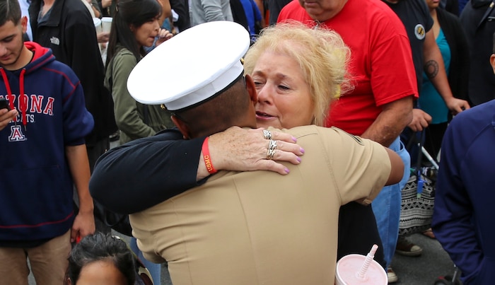 A Marine from Hotel Company, 2nd Recruit Training Battalion, greets his loved one after graduating from recruit training at Marine Corps Recruit Depot San Diego, April 8. After graduation, all Marines are given 10 days of leave before taking the next step in training. Annually, more than 17,000 males recruited from the Western Recruiting Region are trained at MCRD San Diego.