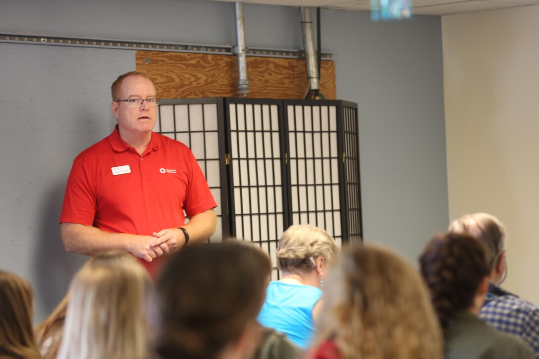 James D. Jarvis, the Service to the Armed Forces Manager for Marine Corps Air Station New River, Marine Corps Base Camp Lejeune & the Cape Fear Area Chapter for the American Red Cross, speaks to Red Cross volunteers at a luncheon on New River. The Camp Lejeune chapter has added nearly 20 volunteers a month since the beginning of the year.