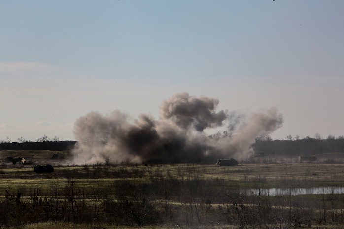 Artillery rounds fired by Marines with 3rd Battalion, 14th Marine Regiment make impact on Gun Position 7 as part of exercise Saipan Rain at Camp Lejeune, N.C., March 30, 2016. The battery, based out of Navy Operational Support Center, Richmond, Va., joined forces with 10th Marine Regiment to support operations during the exercise. (U.S. Marine Corps photo by Cpl. Paul S. Martinez/Released)