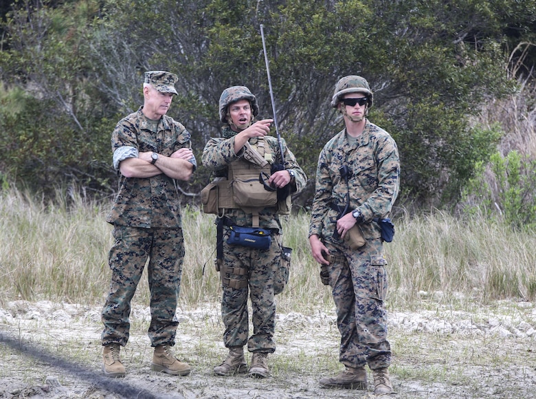 Maj. Gen. Brian Beaudreault, commanding general of 2nd Marine Division, receives a brief by Capt. Kevin Julian, Bridge Company commander, and 2nd Lt. Aaron Barlow, combat engineer officer, both with 8th Engineer Support Battalion, on the company’s water gap crossing operations in support of exercise Saipan Rain at Camp Lejeune, N.C., March 31, 2016. Beaudreault, Sgt. Maj. David Bradford, 2nd Marine Division sergeant major, and U.S. Navy Master Chief Petty Officer Russell Folley, 2nd Marine Division command master chief, were present to observe the operation. (U.S. Marine Corps photo by Cpl. Paul S. Martinez/Released)