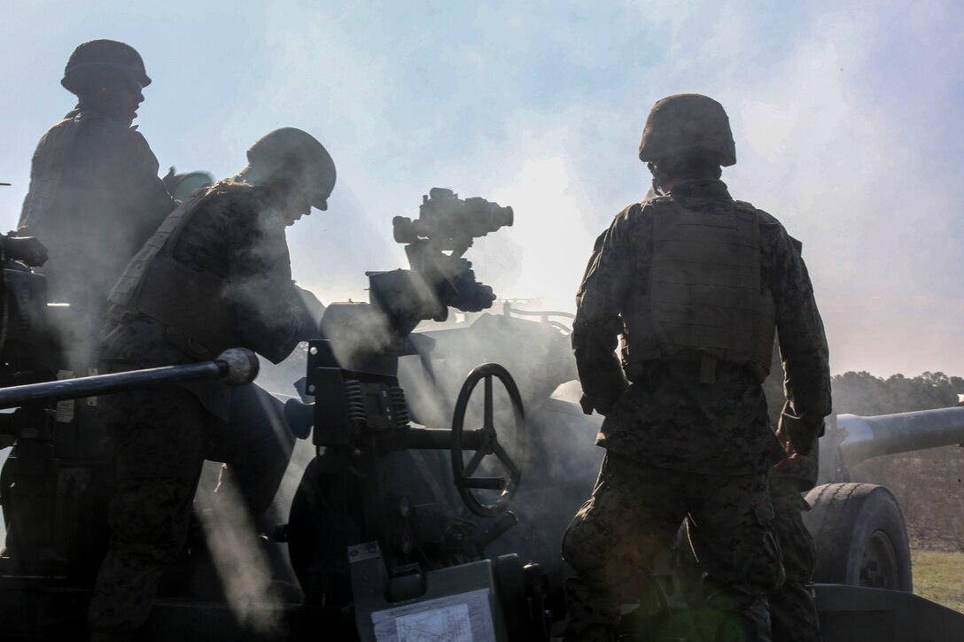 Marines with 3rd Battalion, 14th Marine Regiment fire an M777A2 Howitzer as part of exercise Saipan Rain at Camp Lejeune, N.C., March 30, 2016. The battery, based out of Navy Operational Support Center, Richmond, Va., joined forces with 10th Marine Regiment to support operations during the exercise. (U.S. Marine Corps photo by Cpl. Paul S. Martinez/Released)